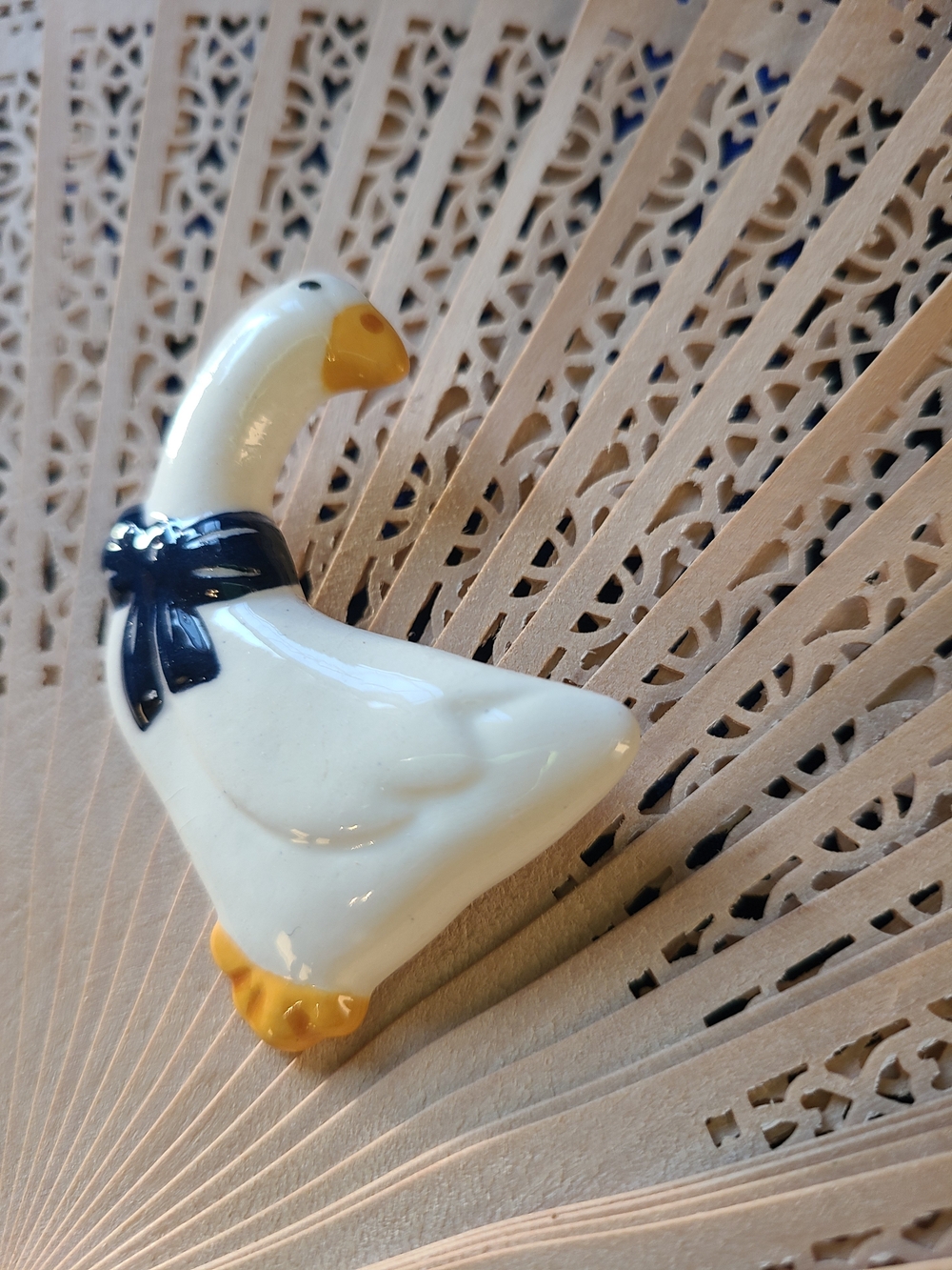 Hand Crafted White Ceramic Goose Brooch with Navy Bow and Yellow Beak